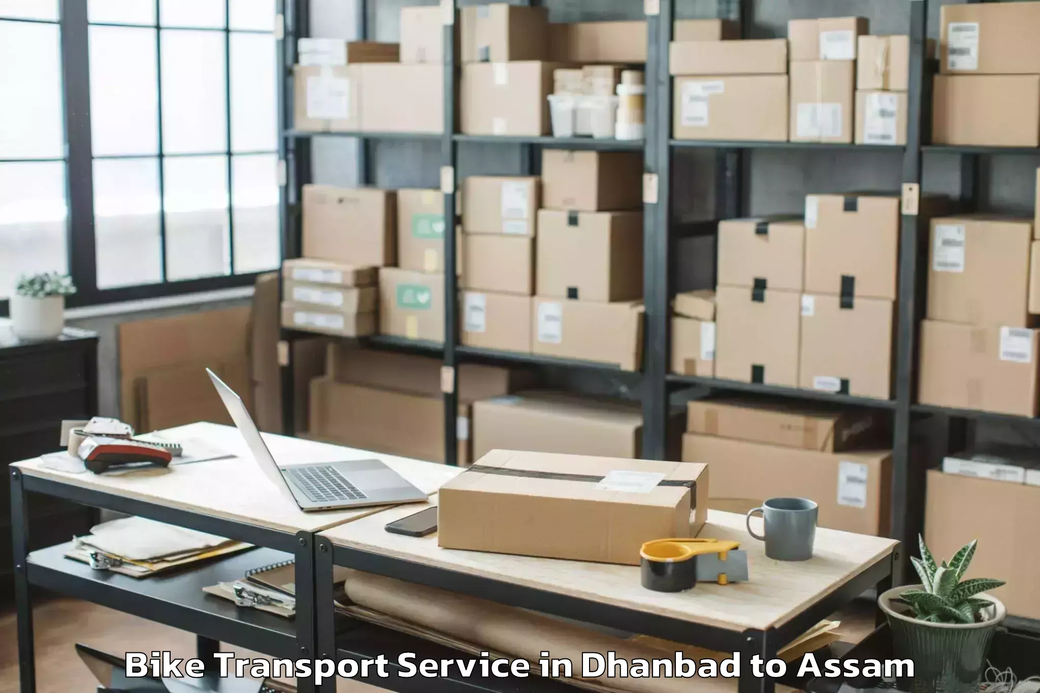 Professional Dhanbad to Bilasipara Bike Transport